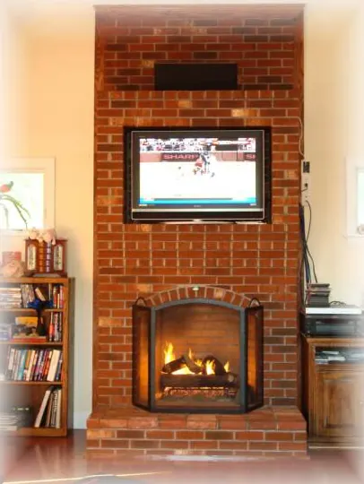 Brick fireplace wall with a raised hearth