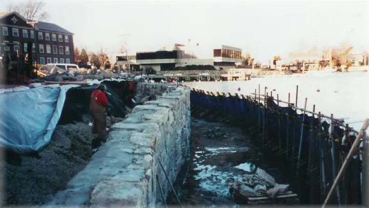 Seawall repair in progress at low tide